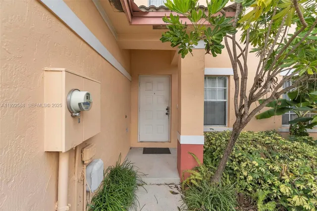 a plant that is in front of a door
