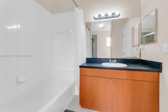 a bathroom with a sink and a bathtub