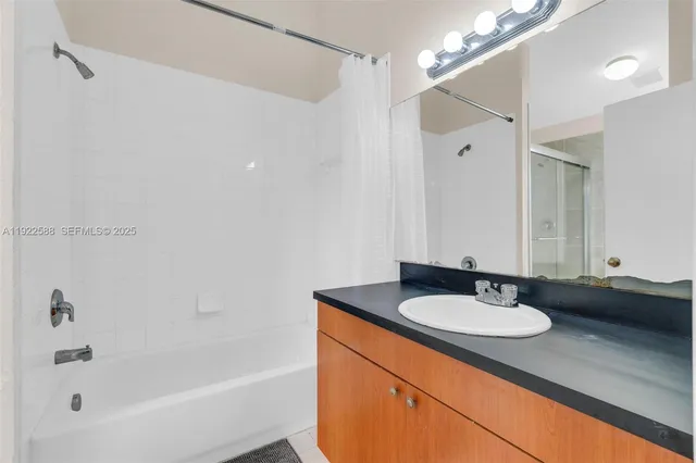 a bathroom with a sink double vanity and a bathtub