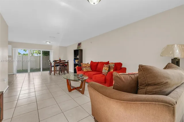 a living room with furniture and a table