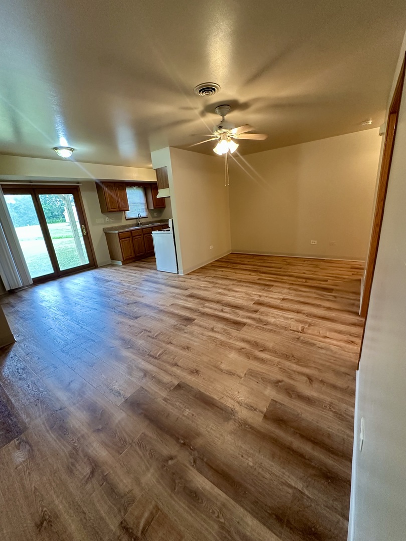 465 North School Street, Unit 473 Diamond, IL 60416 - Photo 3 of 8 a view of an empty room with a window