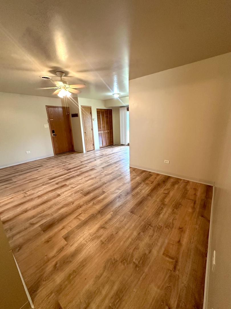 465 North School Street, Unit 473 Diamond, IL 60416 - Photo 4 of 8 a view of empty room with wooden floor