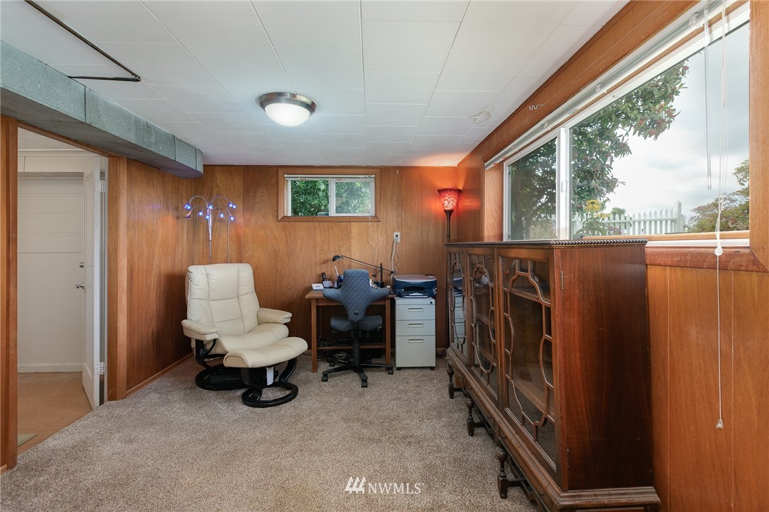 6712 42nd Avenue Southwest Seattle, WA 98136 - Photo 17 of 19 a view of living room with furniture and a window