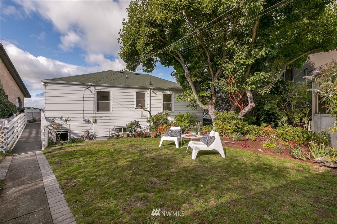 6712 42nd Avenue Southwest Seattle, WA 98136 - Photo 3 of 19 a view of a house with backyard