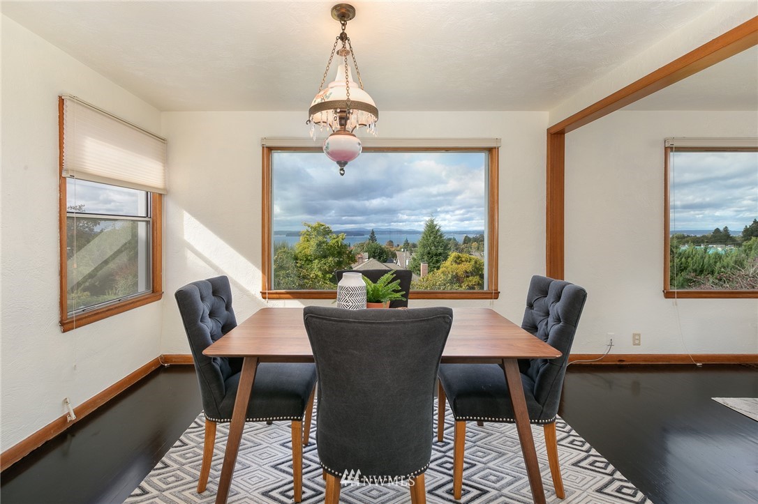 6712 42nd Avenue Southwest Seattle, WA 98136 - Photo 10 of 19 a dining room with furniture and window