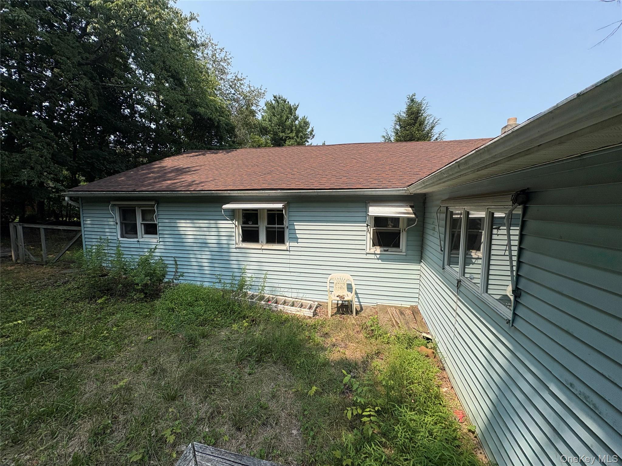 11 Chase Road Wallkill, NY 12589 - Photo 9 of 10 View of home's exterior with a shingled roof