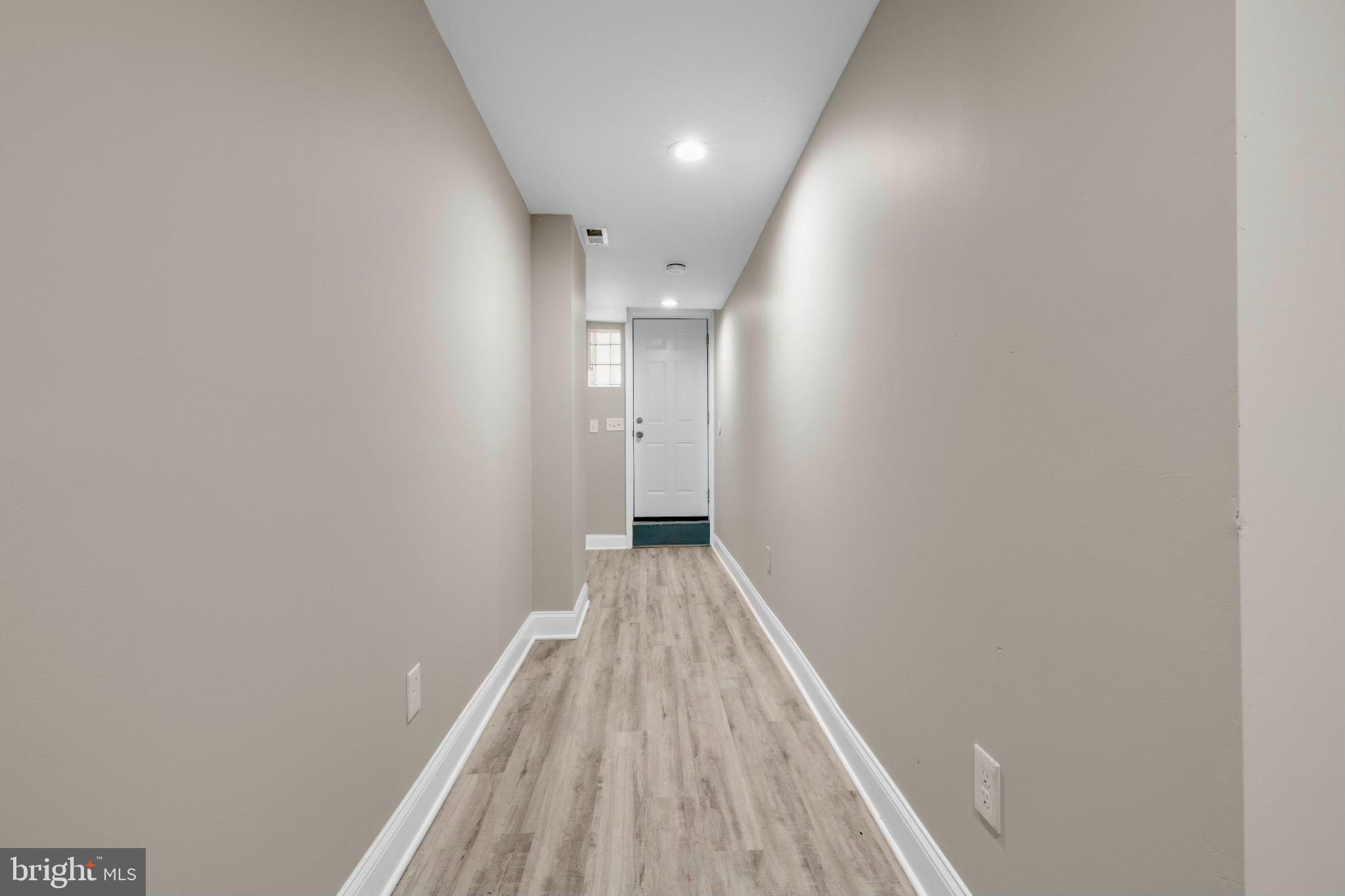 145 North Monastery Avenue Baltimore, MD 21229 - Photo 29 of 45 Inviting hallway with modern charm.