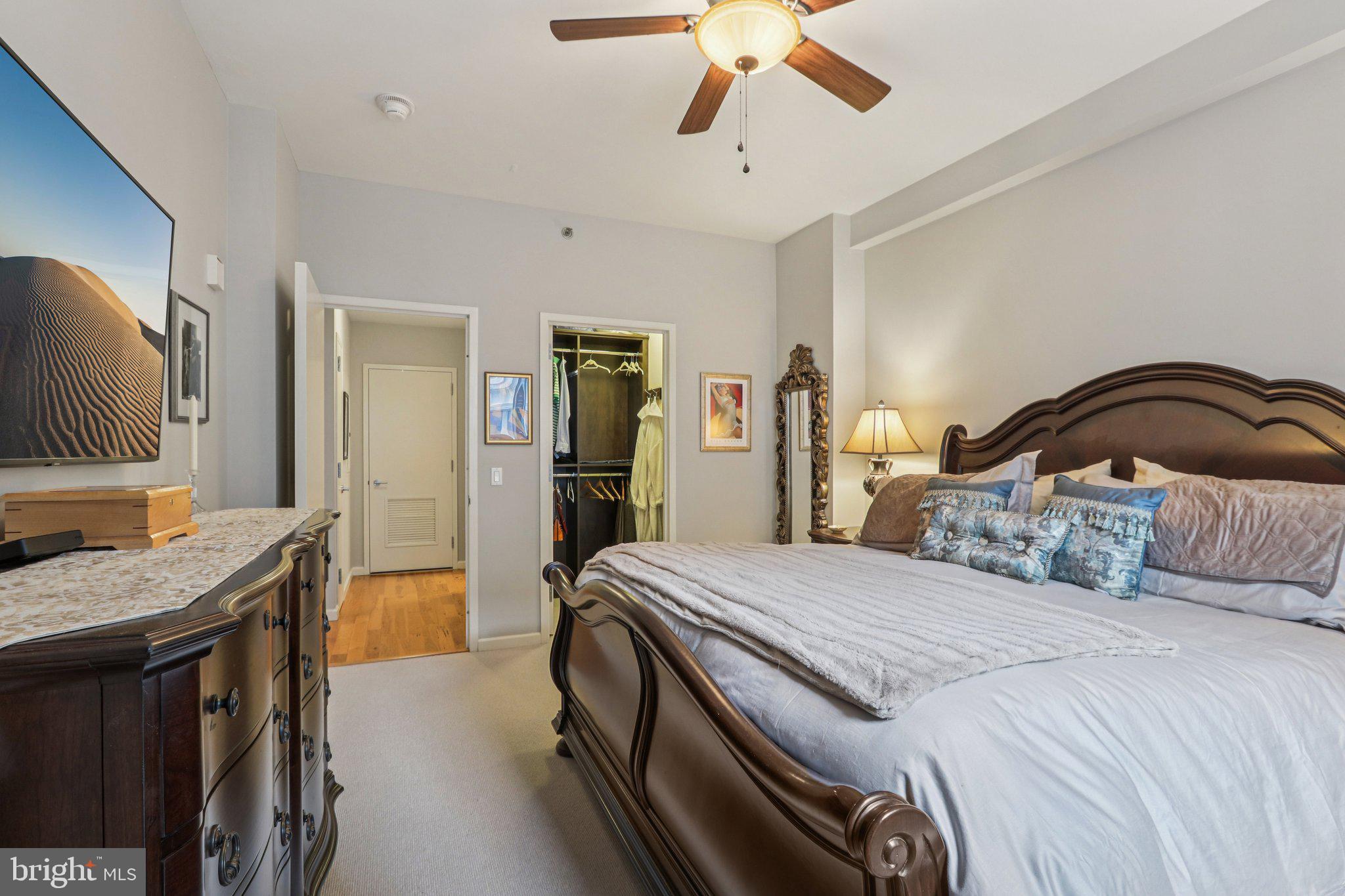 1425 Locust Street, Unit 7D Philadelphia, PA 19102 - Photo 19 of 39 a bedroom with a bed and a flat screen tv