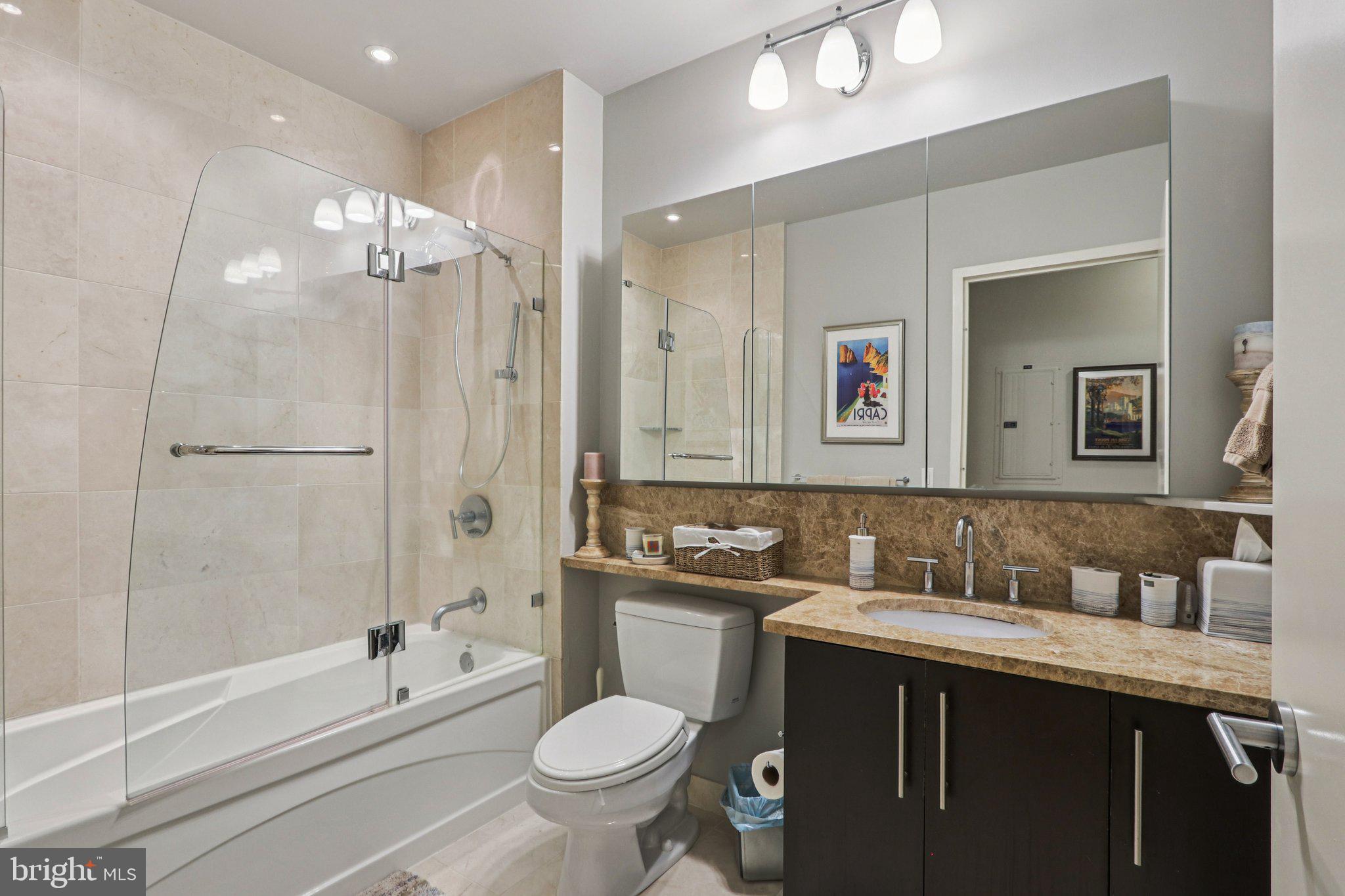 1425 Locust Street, Unit 7D Philadelphia, PA 19102 - Photo 23 of 39 a bathroom with a sink a toilet and shower