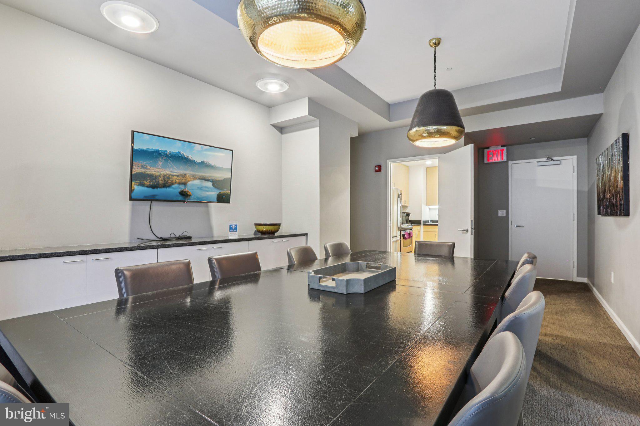1425 Locust Street, Unit 7D Philadelphia, PA 19102 - Photo 29 of 39 a living room with fireplace furniture and a chandelier