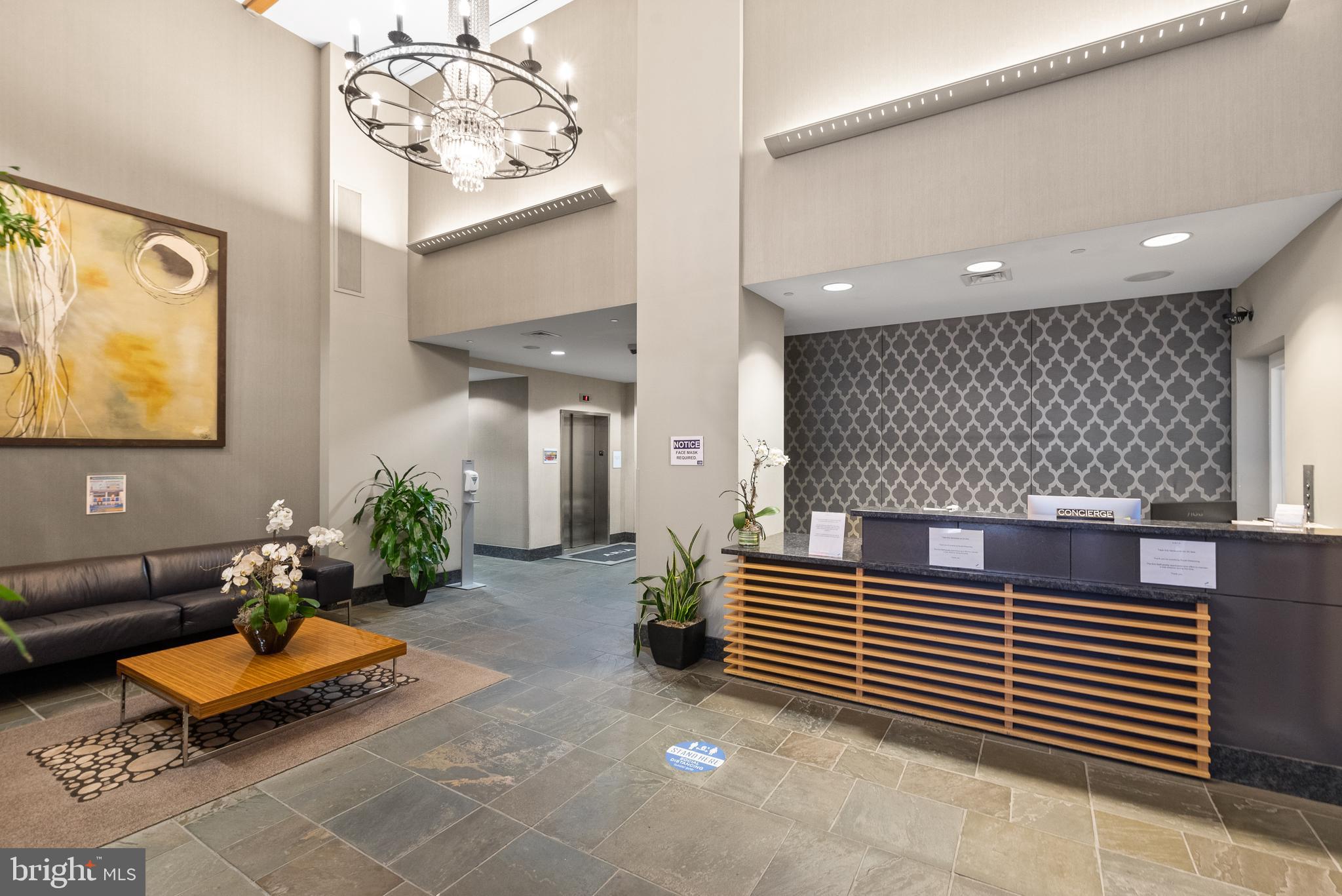1425 Locust Street, Unit 7D Philadelphia, PA 19102 - Photo 3 of 39 a hallway with a table and chairs