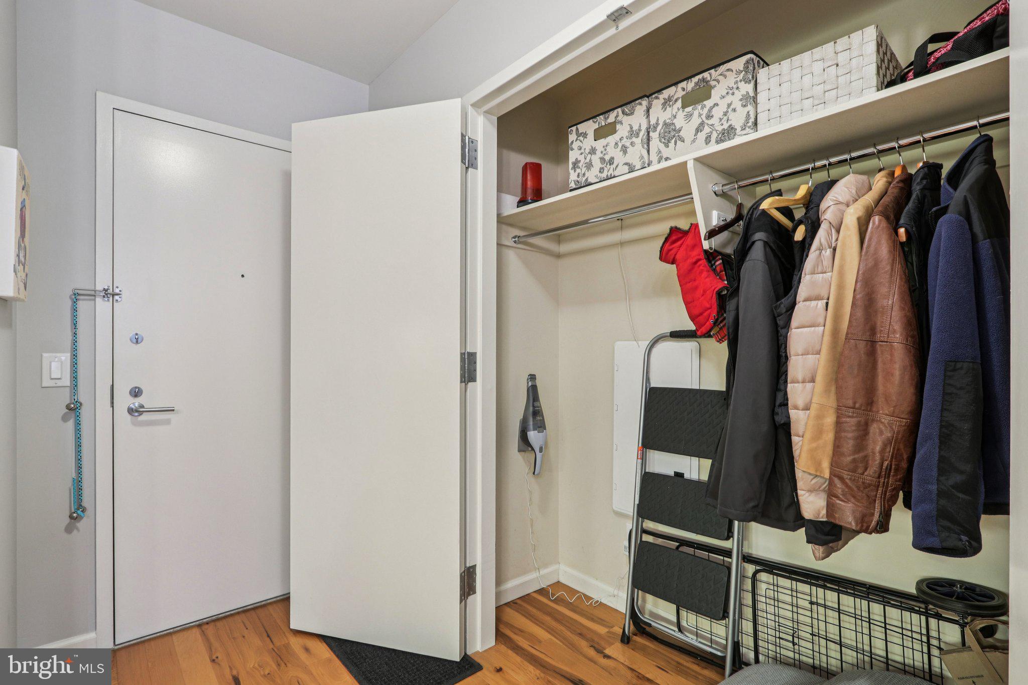 1425 Locust Street, Unit 7D Philadelphia, PA 19102 - Photo 7 of 39 a view of walk in closet with clothes and shoes