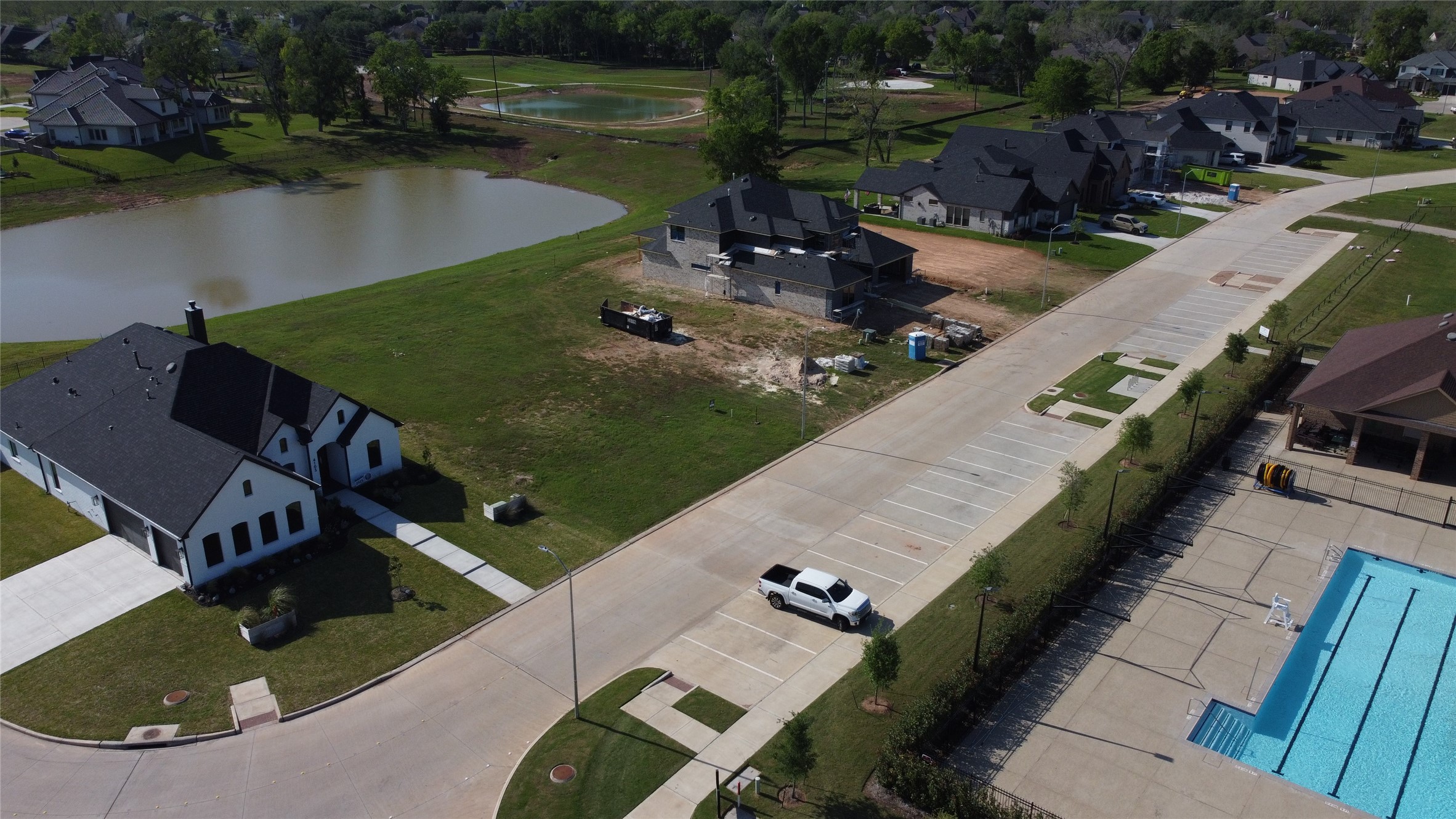 4107 Wooded Isle Way Fulshear, TX 77441 - Photo 4 of 6 an aerial view of a house with a lake view