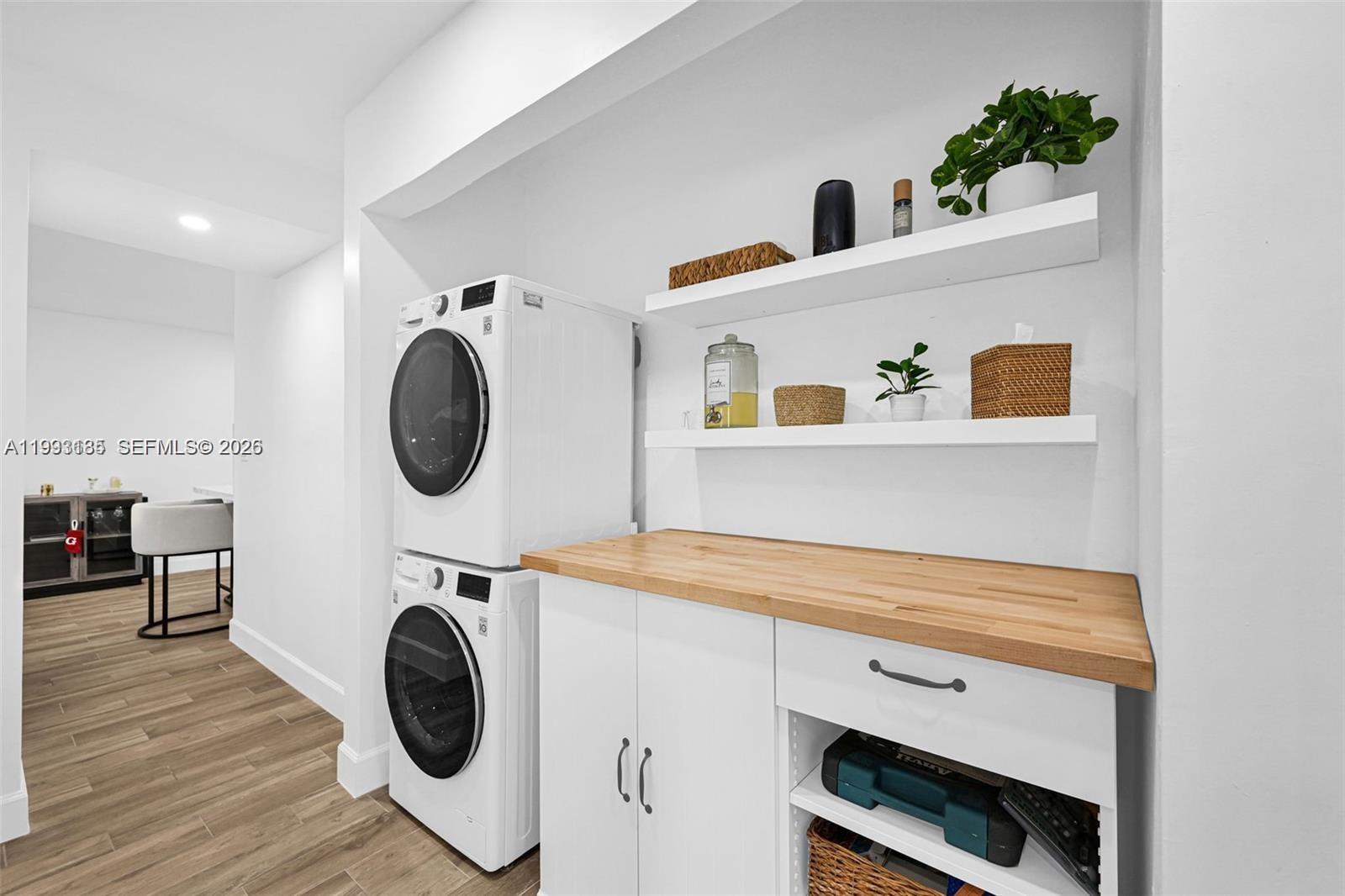 8609 Southwest 68th Court, Unit 24 Pinecrest, FL 33156 - Photo 21 of 39 a view of a kitchen with a washer and dryer