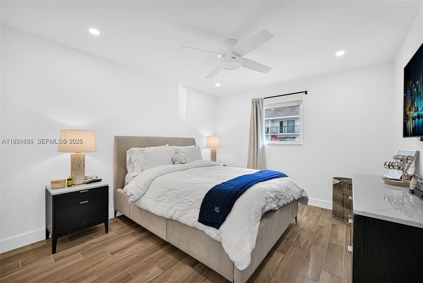 8609 Southwest 68th Court, Unit 24 Pinecrest, FL 33156 - Photo 26 of 39 a bed room with a bed and a table