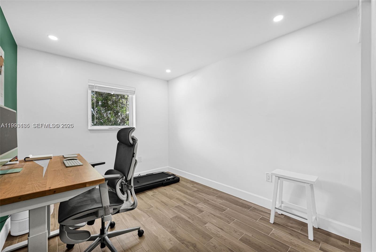 8609 Southwest 68th Court, Unit 24 Pinecrest, FL 33156 - Photo 33 of 39 a view of workspace with hardwood wall