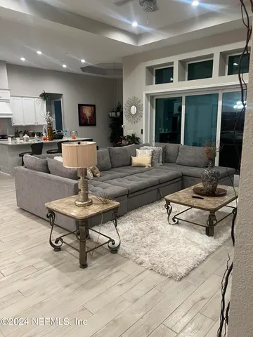 a living room with furniture and a table
