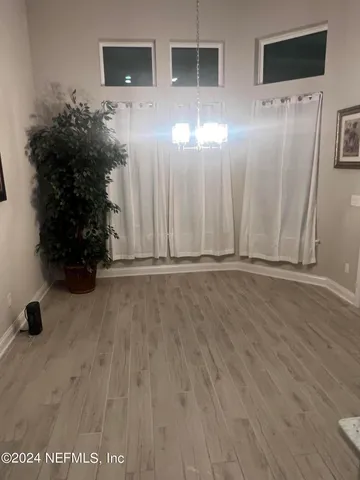 a view of entryway with wooden floor