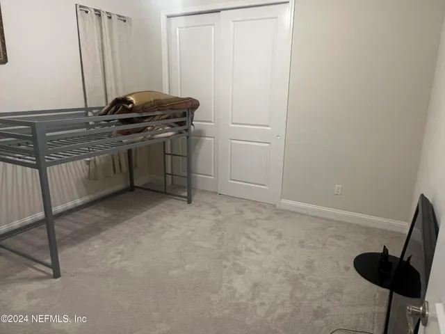 a kitchen with a stove and a refrigerator