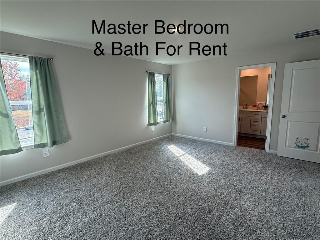 2496 Rocky City Lane Snellville, GA 30078 - Photo 1 of 15 an entryway with a window