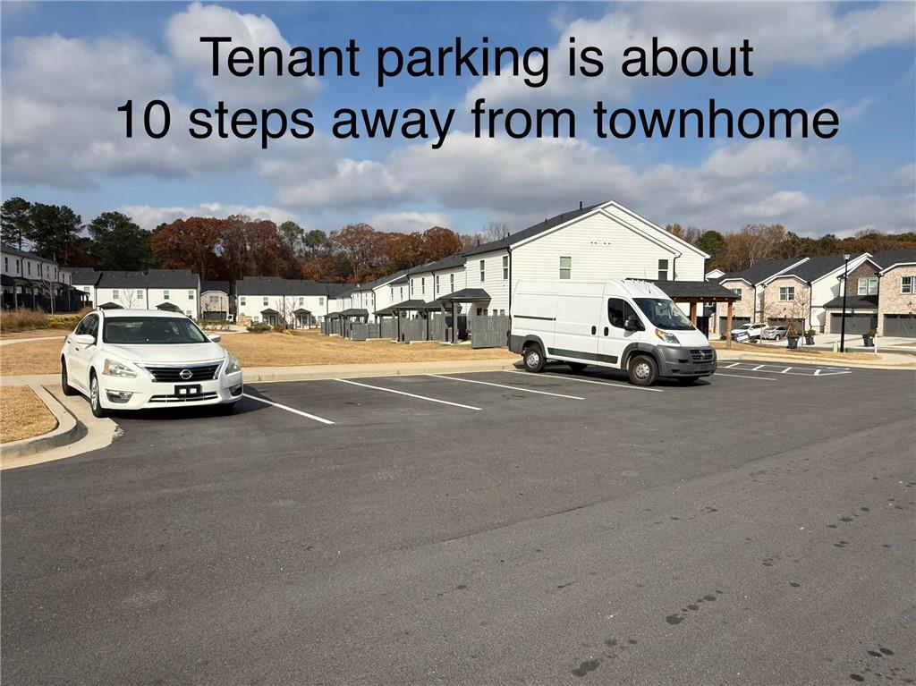 2496 Rocky City Lane Snellville, GA 30078 - Photo 13 of 15 a view of a city street with a car parked on the road