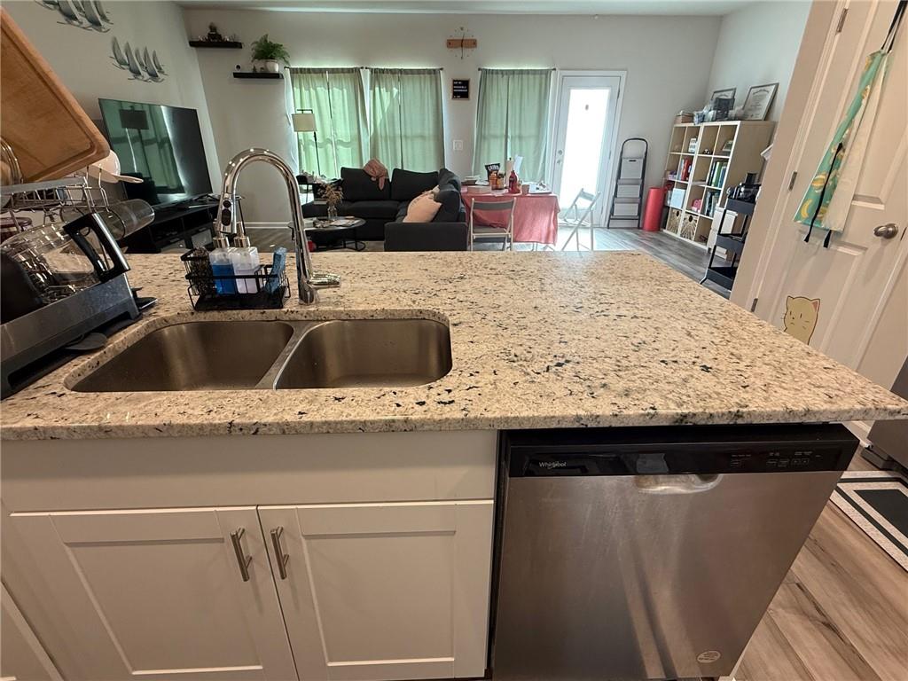 2496 Rocky City Lane Snellville, GA 30078 - Photo 15 of 15 a kitchen with a sink and a refrigerator