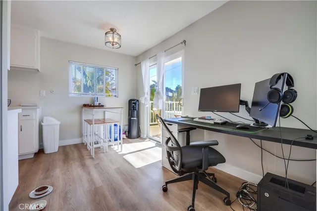 a workspace with furniture and wooden floor