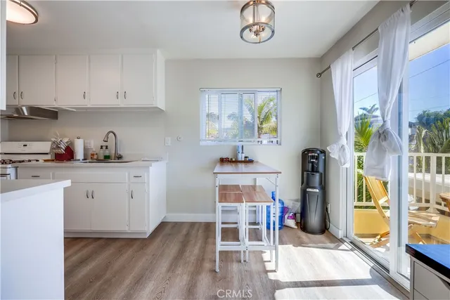 a room with furniture a rug and a window