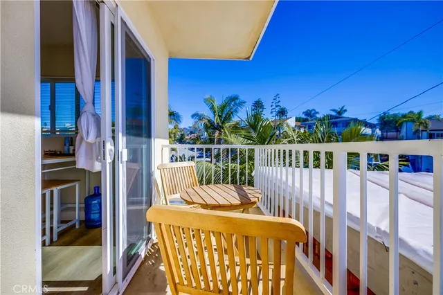 a view of a balcony with furniture