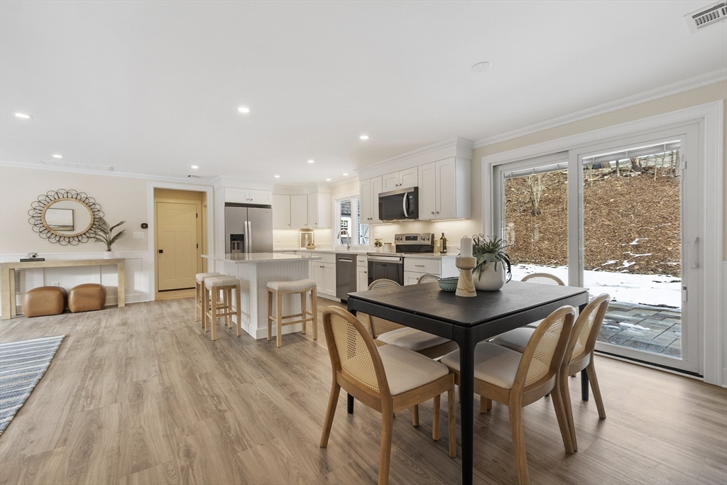 4 Richard Road Hudson, MA 01749 - Photo 13 of 40 a view of a dining room with furniture window and wooden floor