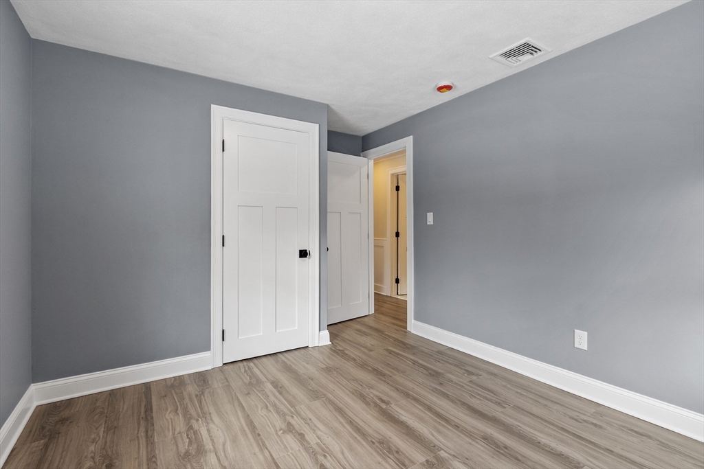 4 Richard Road Hudson, MA 01749 - Photo 21 of 40 a view of an empty room and wooden floor
