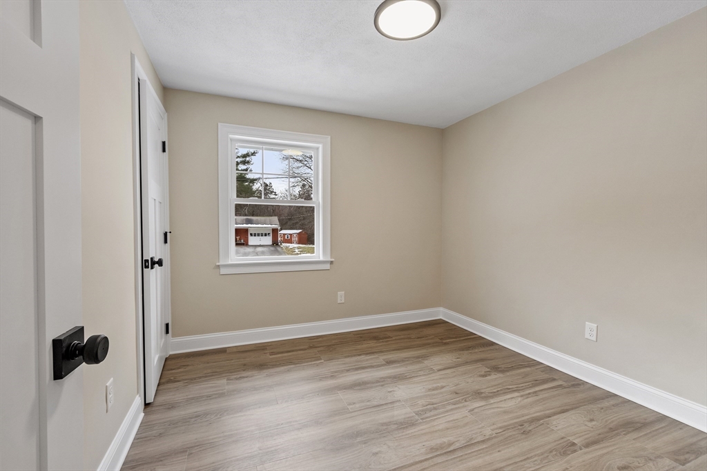 4 Richard Road Hudson, MA 01749 - Photo 22 of 40 a view of a room with wooden floor and window