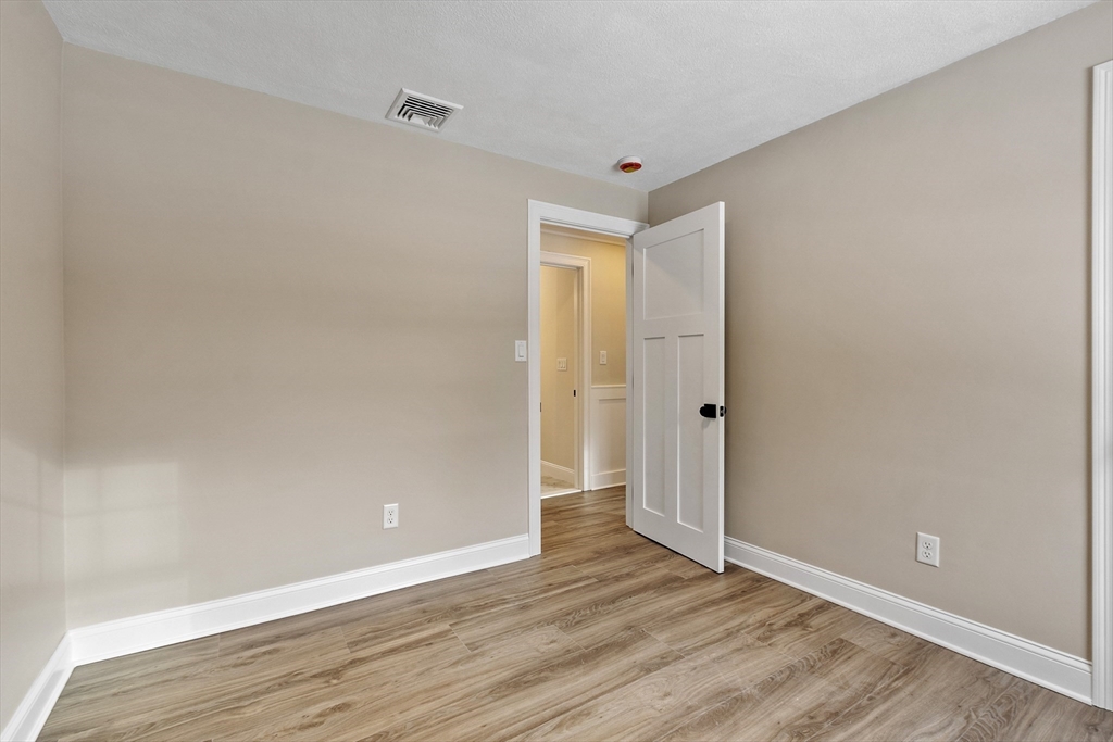 4 Richard Road Hudson, MA 01749 - Photo 24 of 40 a view of an empty room with wooden floor