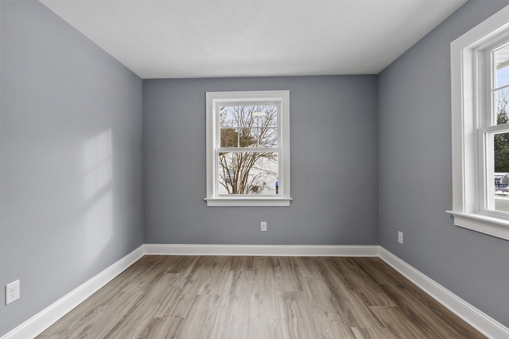 4 Richard Road Hudson, MA 01749 - Photo 25 of 40 a view of an empty room with wooden floor and window