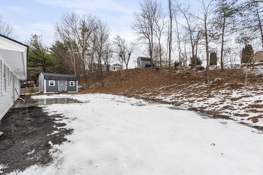 4 Richard Road Hudson, MA 01749 - Photo 30 of 40 a street view with large trees