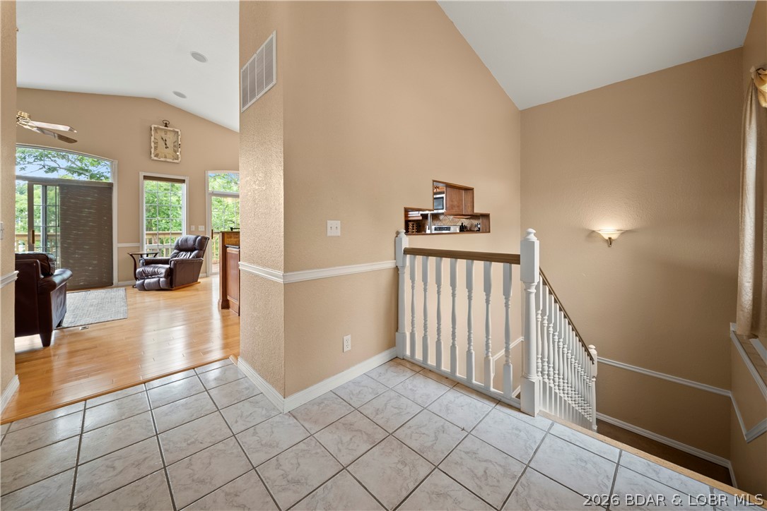 2247 Breezy Acres Road Osage Beach, MO 65065 - Photo 24 of 53 Front Entry has staircase to lower floor