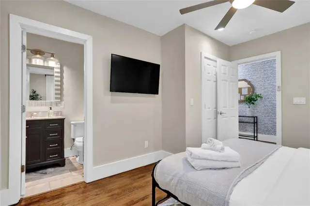 a bedroom with a bed and a television