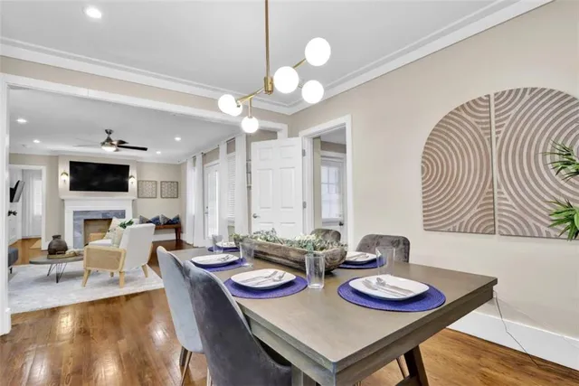 a view of a dining room with furniture and wooden floor