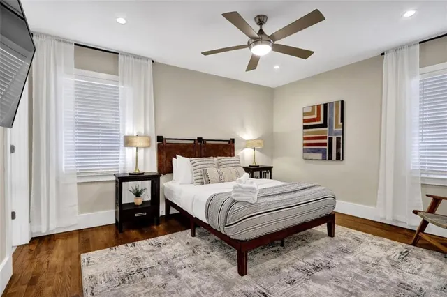 a bathroom with a sink vanity mirror and toilet