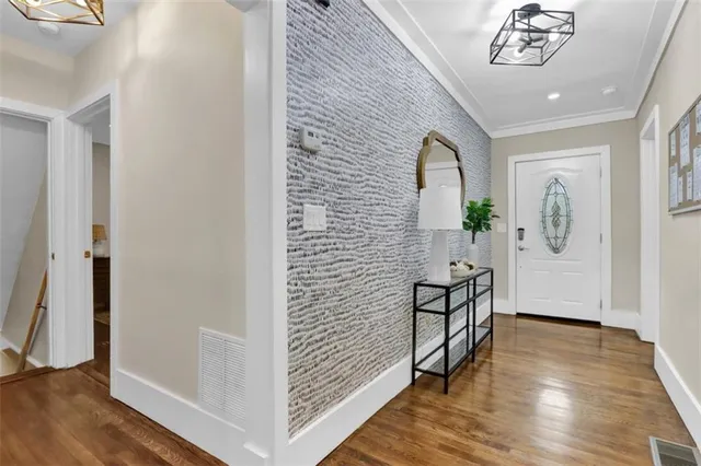 a view of an entryway with wooden floor