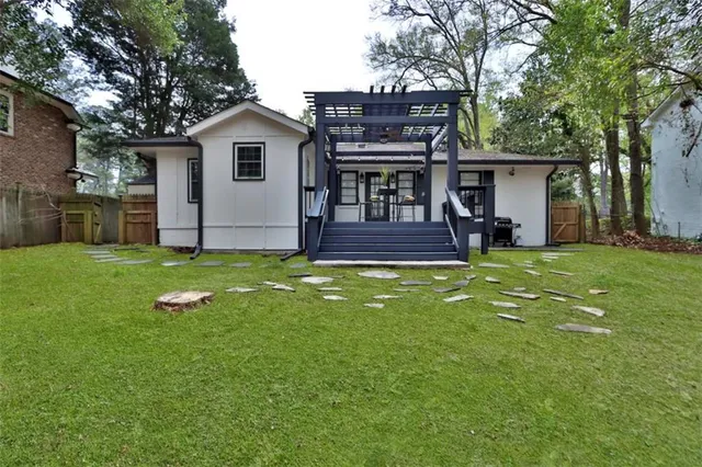 a kitchen with a sink cabinets and window