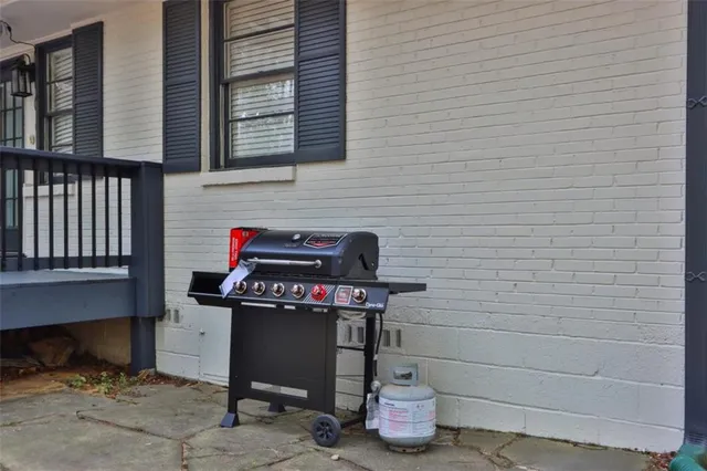 a view of green field with trees in the background
