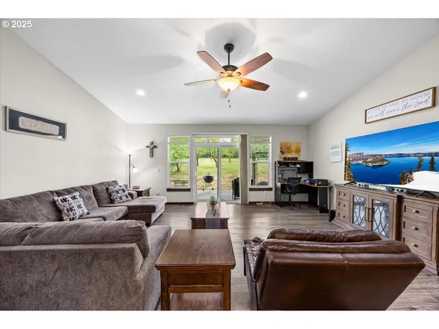 a living room with furniture and a large window