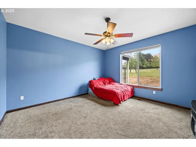 a bed room with a bed and a window