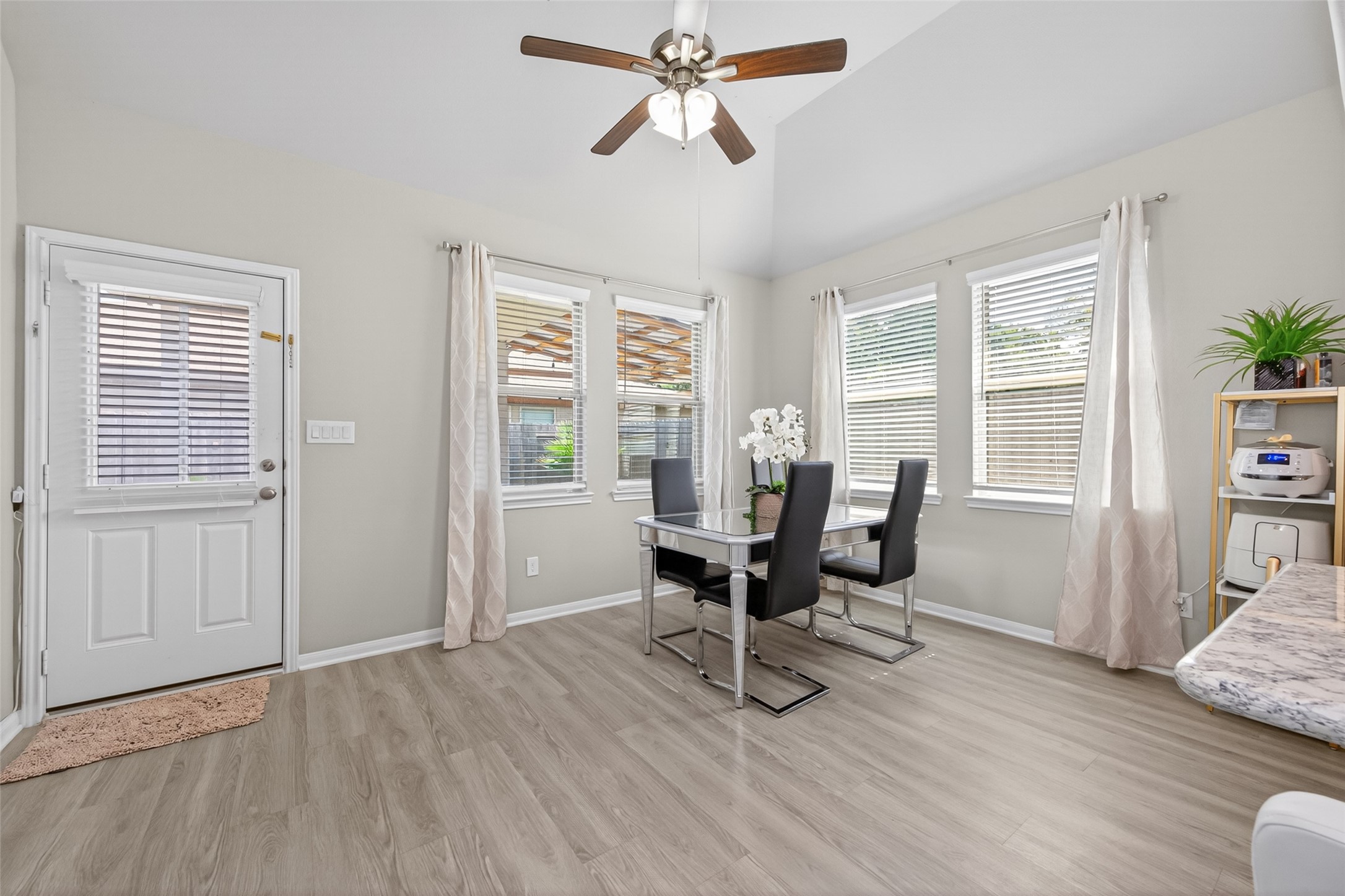 22409 Kinley Street New Caney, TX 77357 - Photo 25 of 46 a view of a workspace with furniture and a window