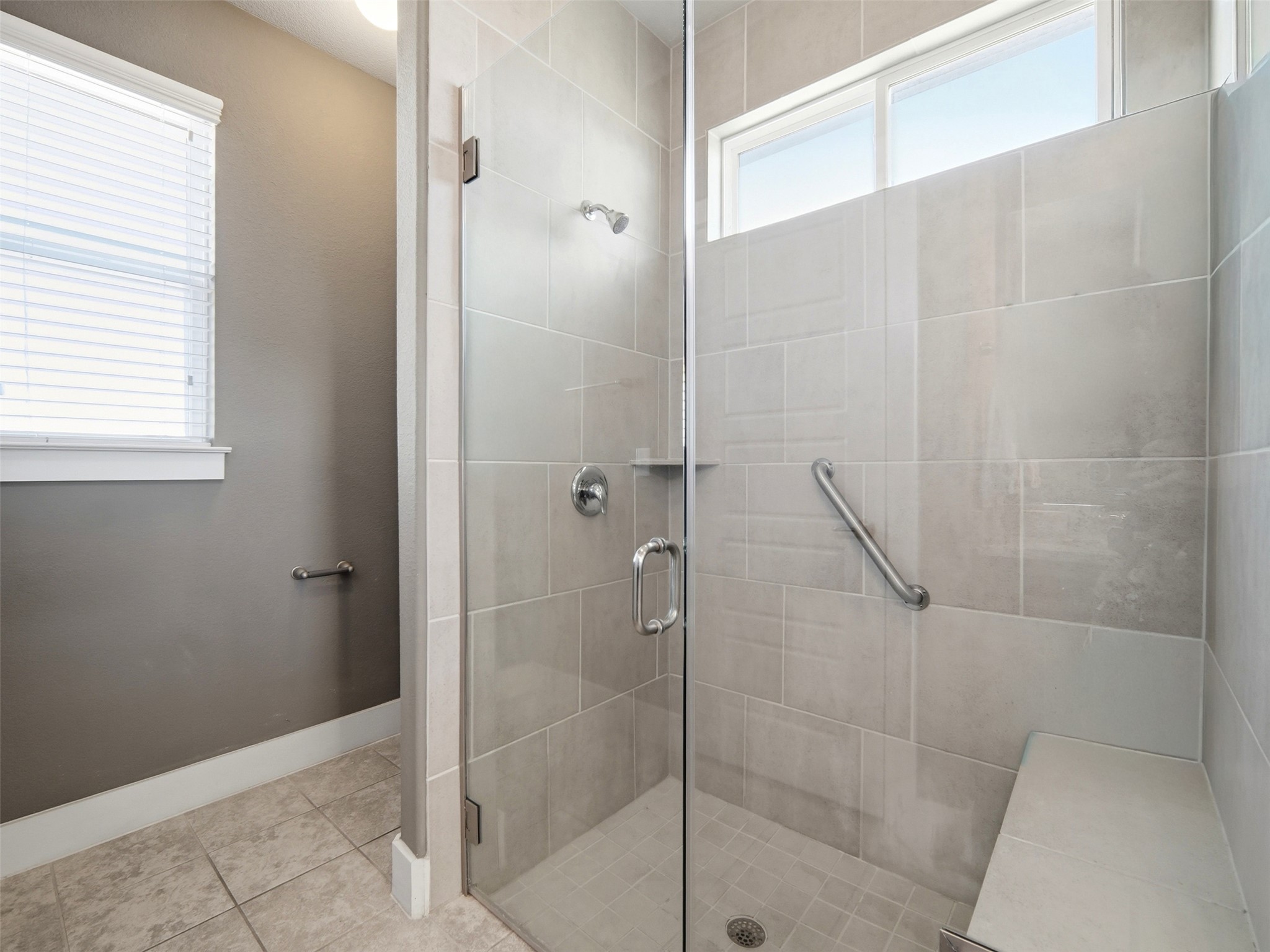 6916 Cardinal Bloom Loop Austin, TX 78744 - Photo 13 of 37 a bathroom with a shower