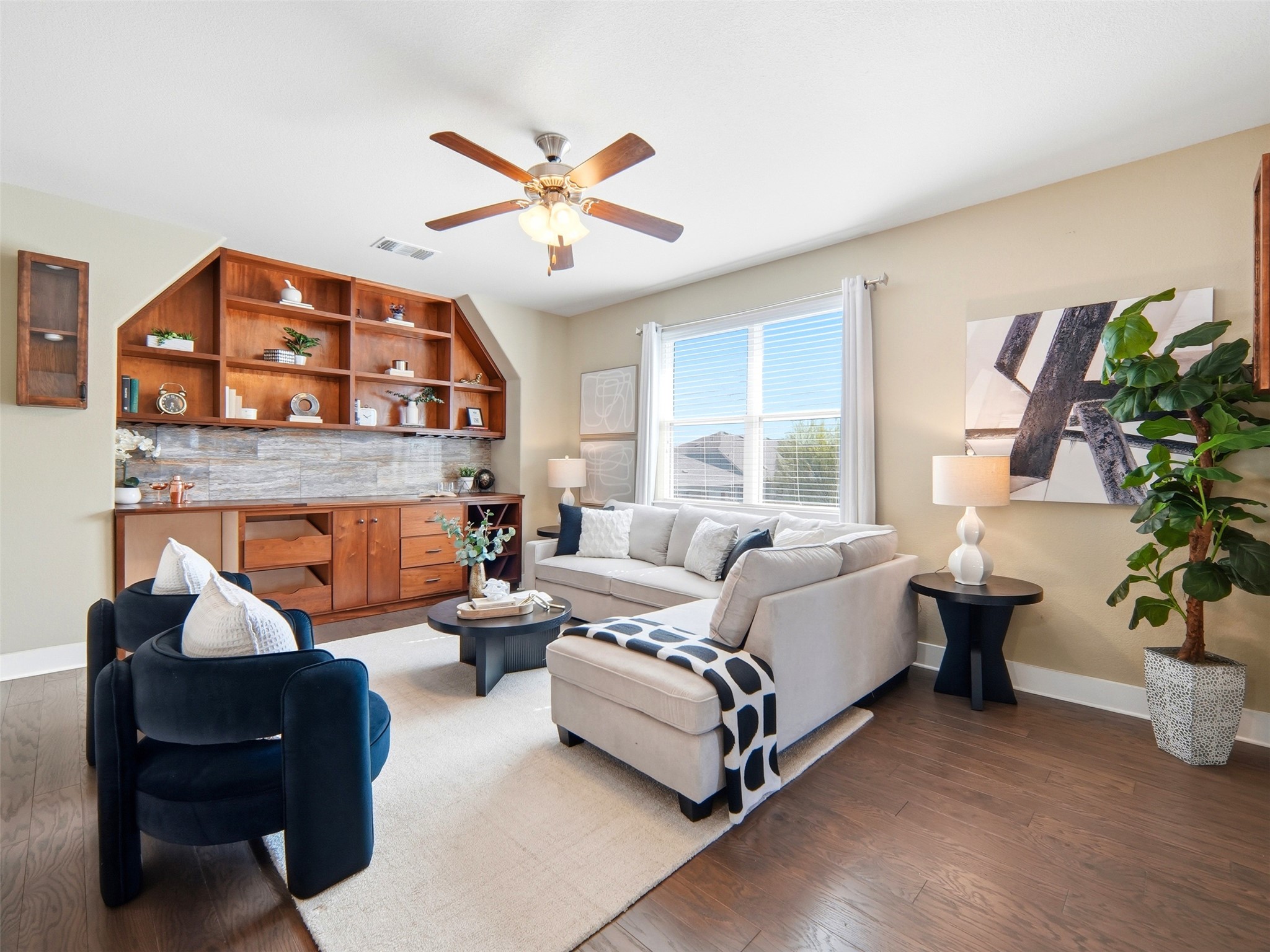 6916 Cardinal Bloom Loop Austin, TX 78744 - Photo 15 of 37 a living room with furniture and a large window