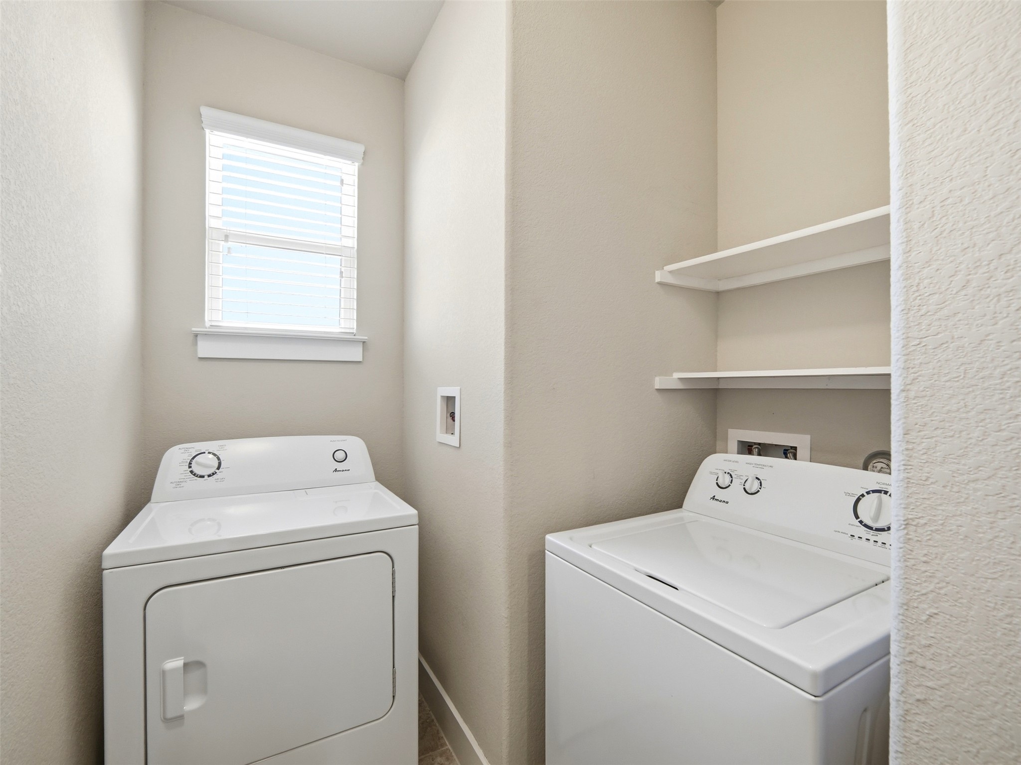 6916 Cardinal Bloom Loop Austin, TX 78744 - Photo 23 of 37 a utility room with dryer and washer