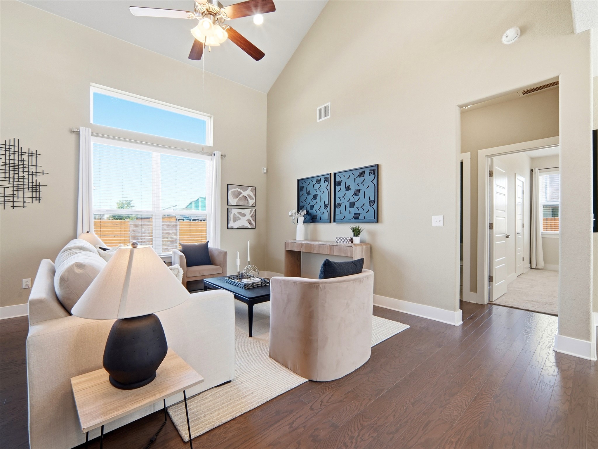 6916 Cardinal Bloom Loop Austin, TX 78744 - Photo 6 of 37 a living room with furniture and a large window