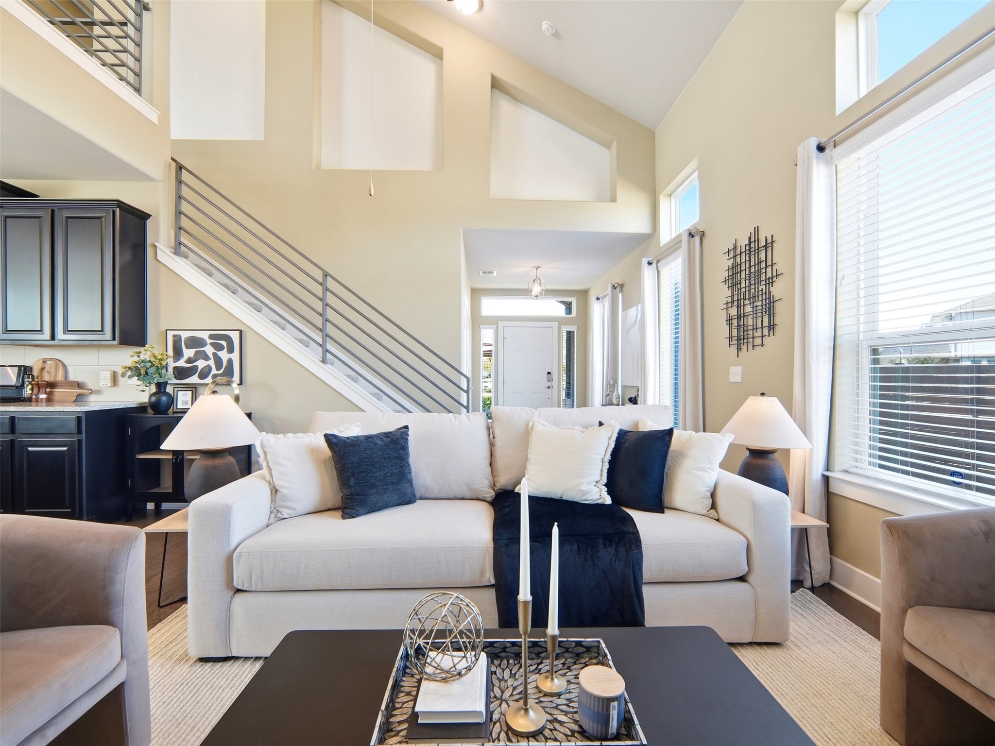 6916 Cardinal Bloom Loop Austin, TX 78744 - Photo 8 of 37 a living room with furniture and a large window